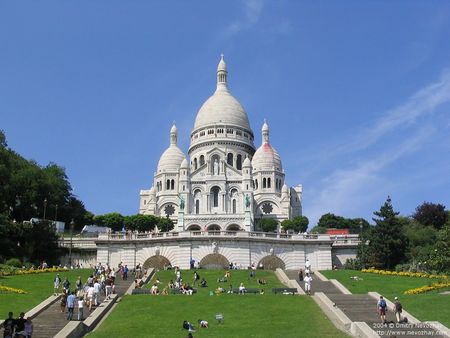 Sacre Coeur front below, blue skies, stairs full of tourists